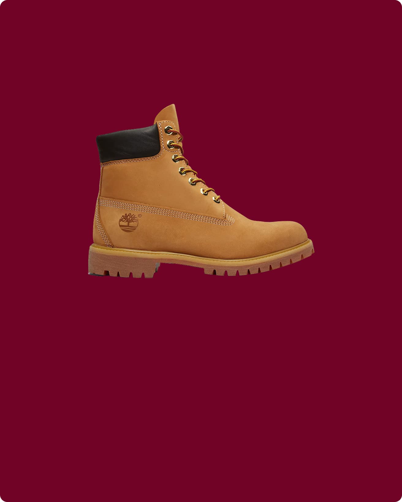 Tan leather boot on a maroon background.