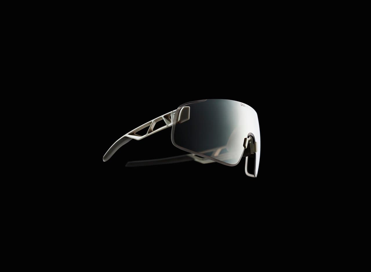 Futuristic sunglasses with a sleek, angular design and reflective lenses, set against a black background.