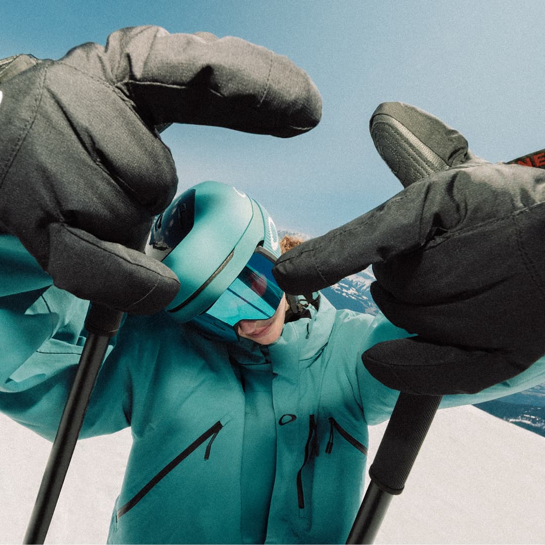 Man posing in front of camera wearing Oakley clothes and gear