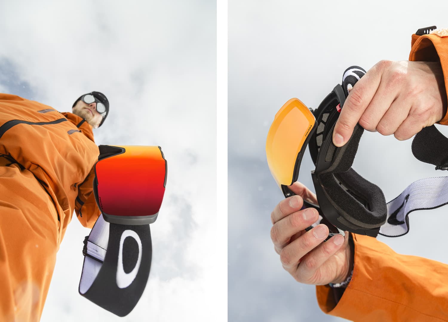 Person in an orange jacket holding ski goggles with interchangeable lenses, shown from a low angle against a cloudy sky.