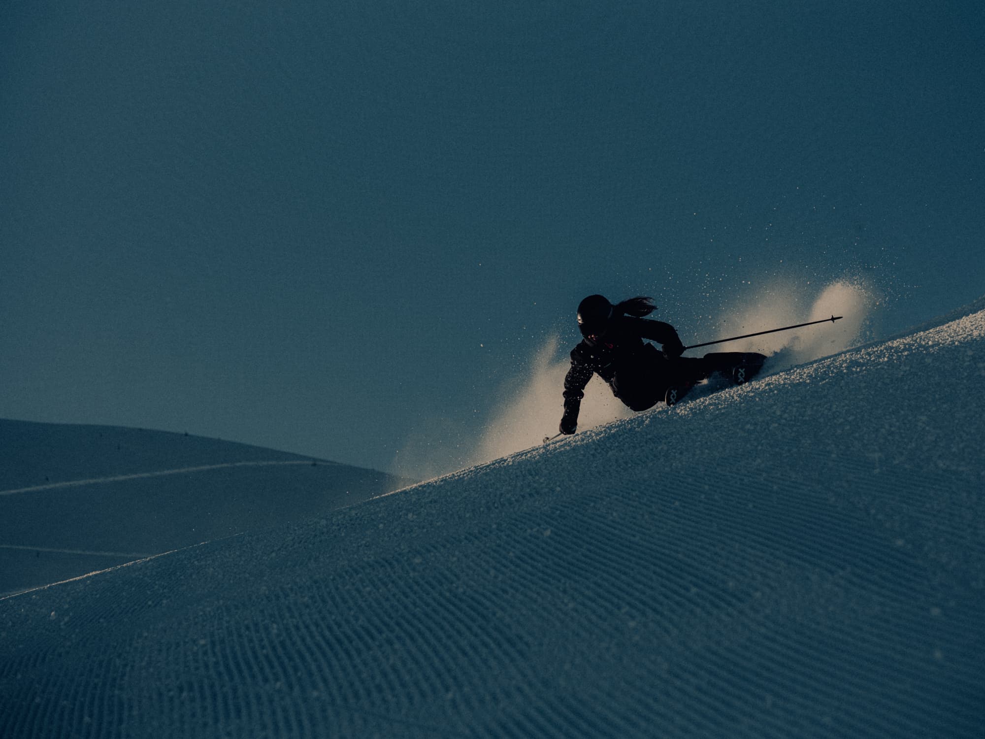 Skier carving down a piste
