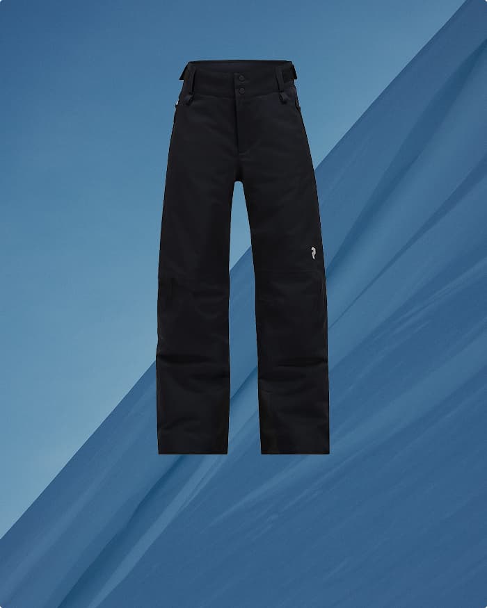 Black ski pants on a blue textured background, featuring zippered pockets and button closure.