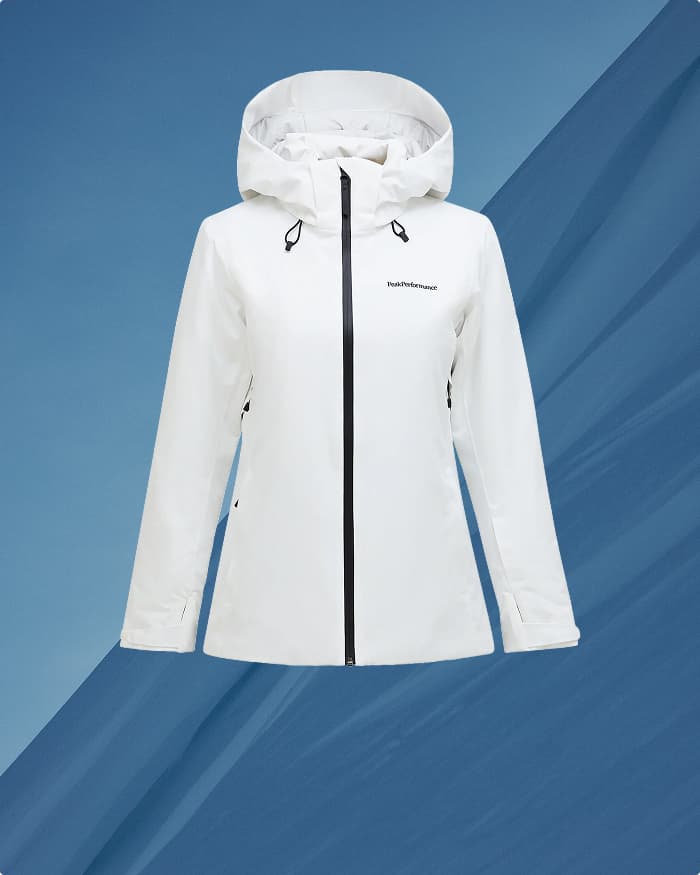 White hooded jacket with black zippers on a blue abstract background.